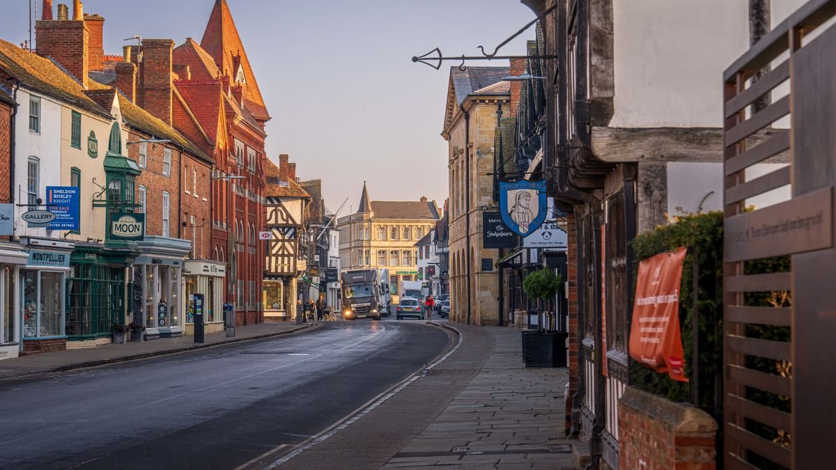 Picturesque street scene in Stratford-upon-Avon, England showcasing charming architecture at dusk.